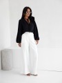 Elegancka bluzka damska z kwiatem Me gusta czarna